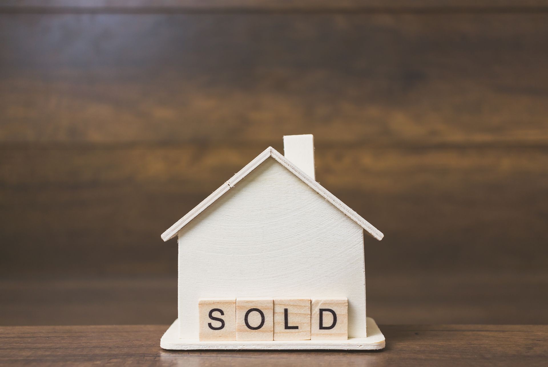 House model with Sold word on wooden blocks. Home finance concept
House model with Sold word on wooden blocks. Home finance concept